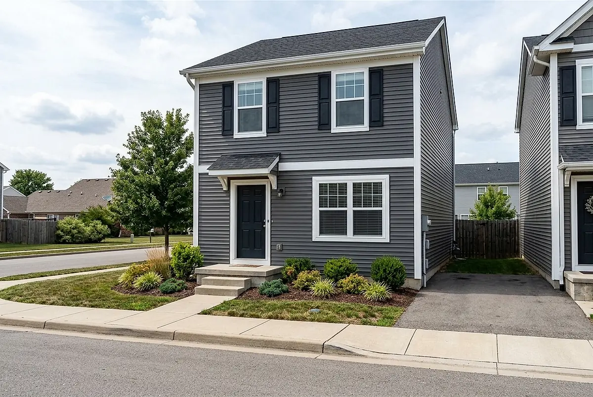 The two bedroom townhouse at 145 Willow Bend Court, with grey siding and a small front stoop
