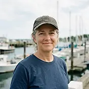 Marcia T. of Beaufort, standing on the dock