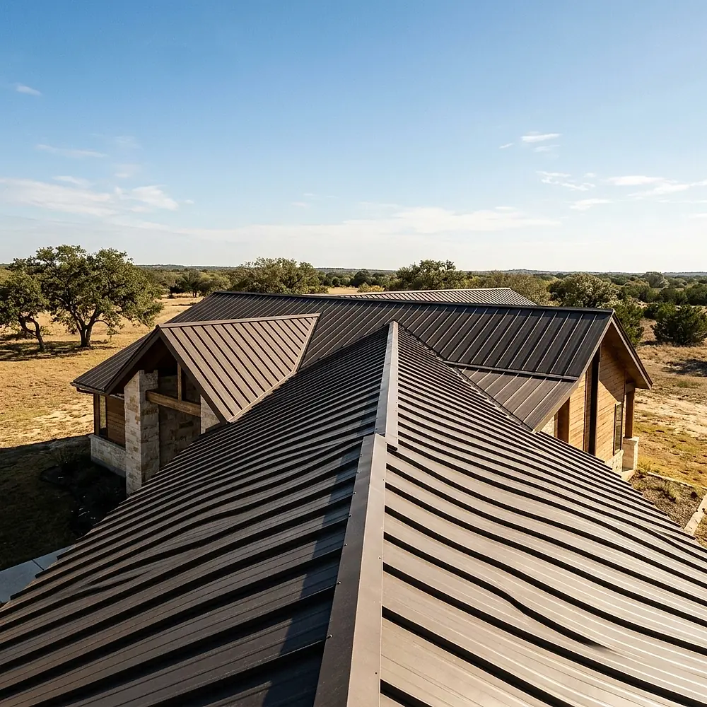 A dark standing seam metal roof with crisp raised seams in strong sunlight.